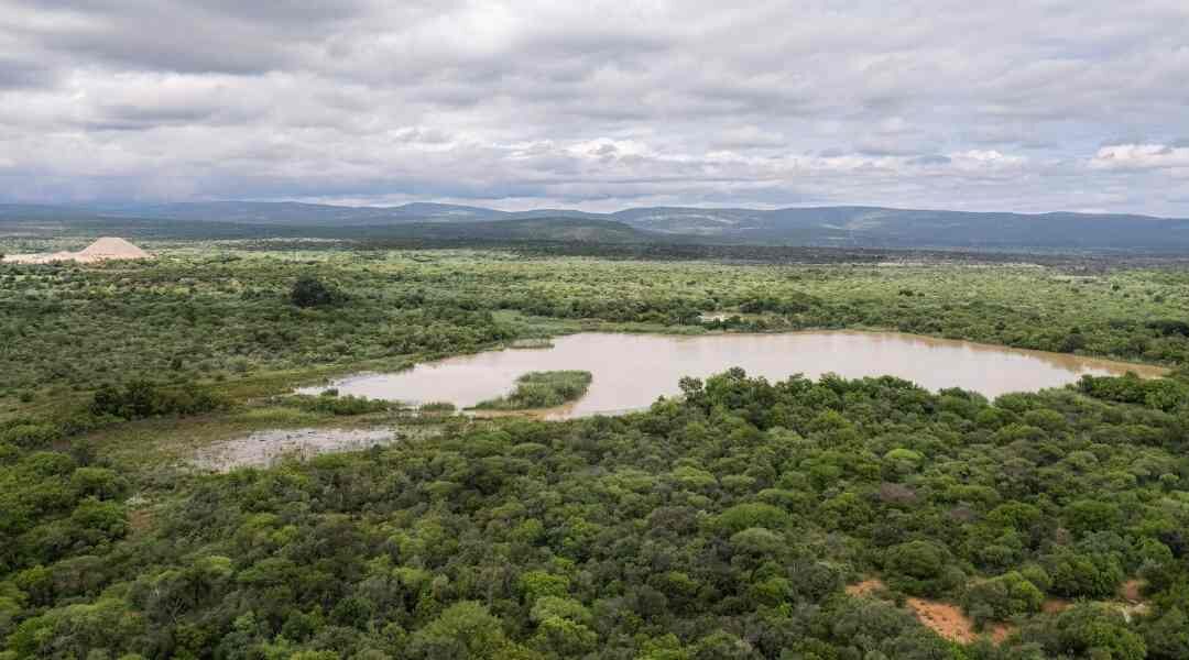 TIN BENEATH THE RED EARTH